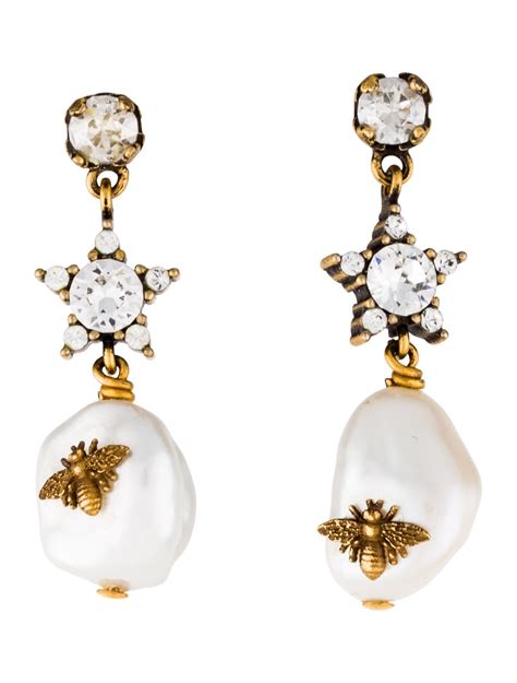 dior earrings pearl yellowish